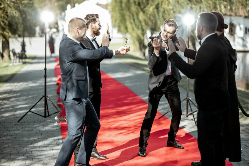 Movie actors on the red carpet outdoors